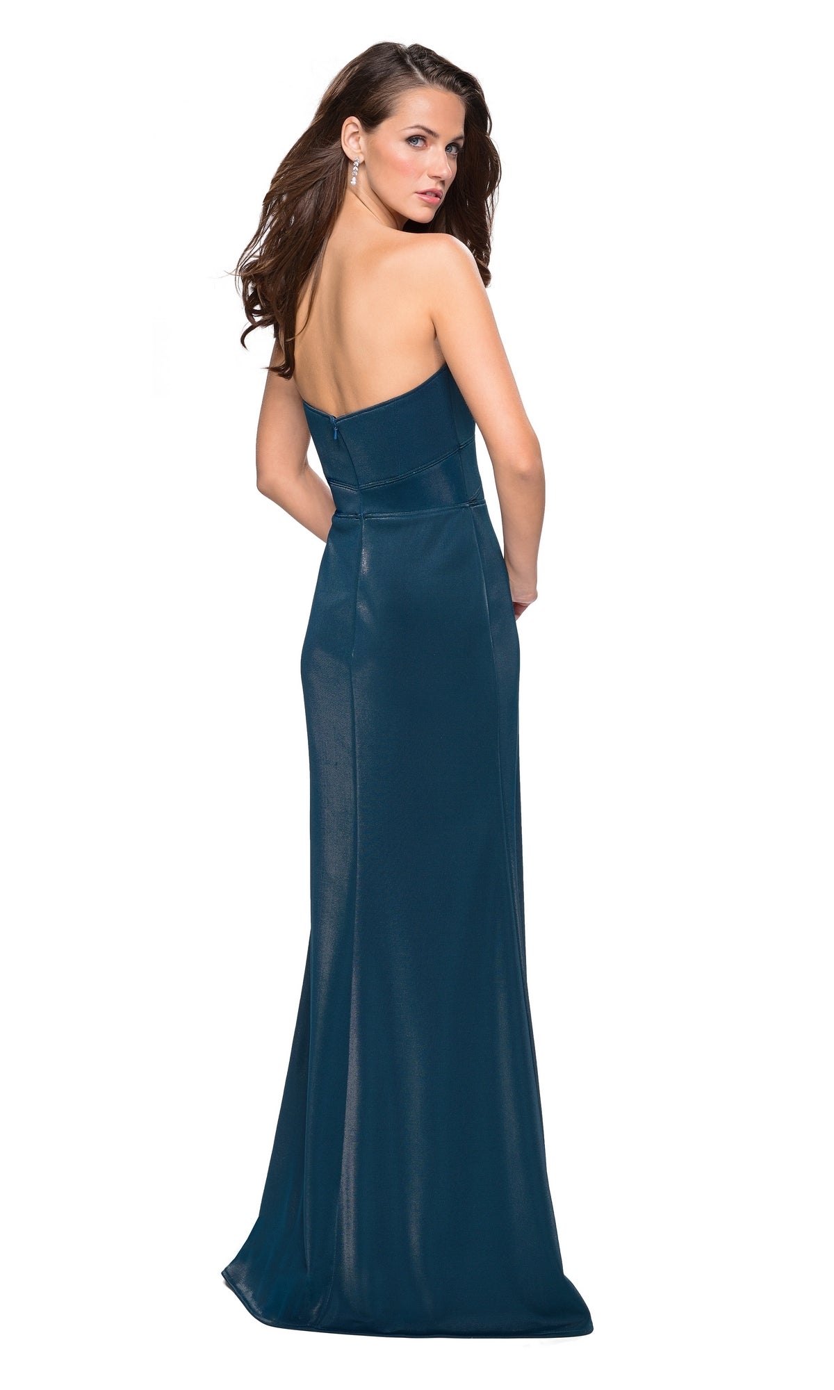 A woman wears the La Femme Strapless Fitted Jersey Prom Dress 27051, a floor-length dark teal gown with a sweetheart neckline, posing with her back to the camera and looking over her shoulder.